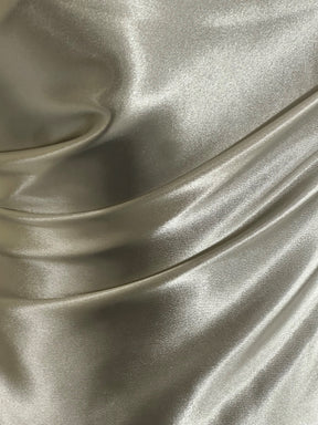 Satin extensible en polyester ivoire - Courage